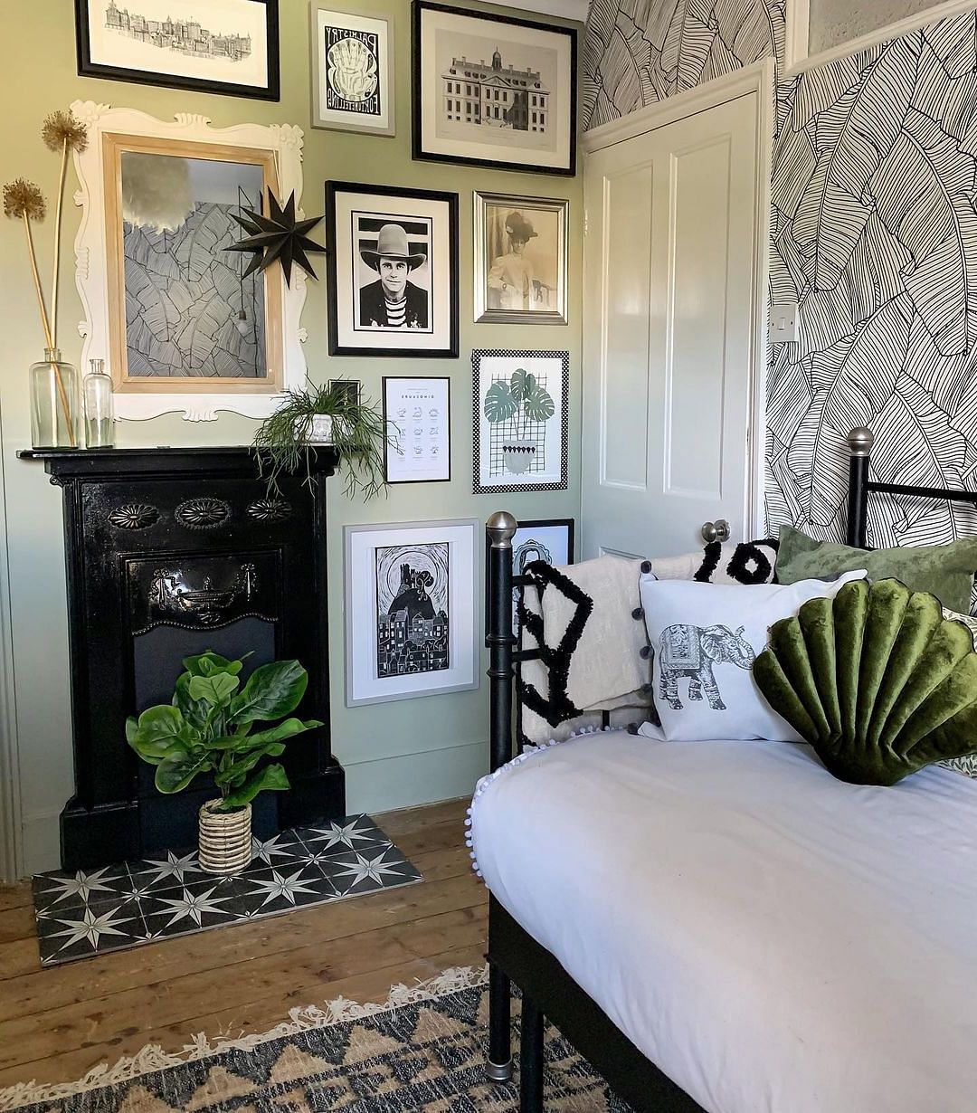 Black and white bedroom deals with green accents